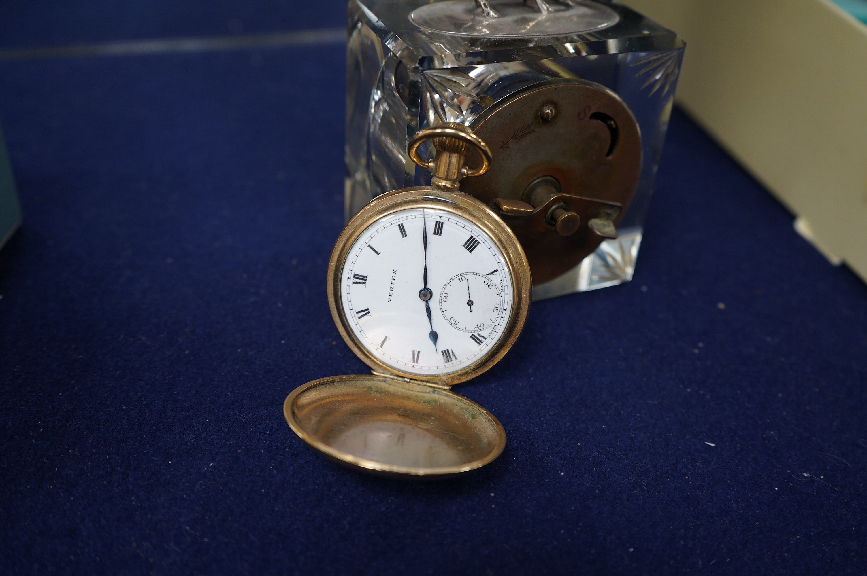 A gold plated Vertex hunter pocket watch and a George V silver mounted glass desk timepiece, with pig finial, height 95mm. Condition - poor.